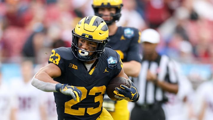 Dec 31, 2024; Tampa, FL, USA; Michigan Wolverines running back Jordan Marshall (23) runs with the ball against the Alabama Crimson Tide in the first quarter during the ReliaQuest Bowl at Raymond James Stadium. Mandatory Credit: Nathan Ray Seebeck-Imagn Images Dec 31, 2024; Tampa, FL, USA; Michigan Wolverines running back Jordan Marshall (23) runs with the ball against the Alabama Crimson Tide in the first quarter during the ReliaQuest Bowl at Raymond James Stadium. Mandatory Credit: Nathan Ray Seebeck-Imagn Images