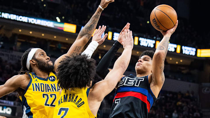 Apr 7, 2023; Indianapolis, Indiana, USA; Detroit Pistons guard Killian Hayes (7) shoots the ball while Indiana Pacers guard Andrew Nembhard (2) and forward Isaiah Jackson (22) defend in the second half at Gainbridge Fieldhouse. Mandatory Credit: Trevor Ruszkowski-Imagn Images
