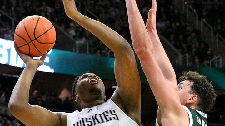 Huskies back-up center KC Ibekwe (24) tries to get a shot over Michigan State center Szymon Zapala in East Lansing. Huskies back-up center KC Ibekwe (24) tries to get a shot over Michigan State center Szymon Zapala in East Lansing.
