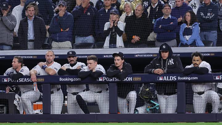 Oct 7, 2026; Bronx, New York, USA; New York Yankees third baseman Ryan McMahon (19) and first baseman Paul Goldschmidt (48) and catcher Austin Wells (28) and designated hitter Ben Rice (22) and starting pitcher Max Fried (54) and injured right fielder Aaron Judge (99) and center fielder Trent Grisham (12) watch from the dugout during the eighth inning of game three of the ALDS against the Tampa Bay Rays during the 2026 MLB Playoffs at Yankee Stadium. Mandatory Credit: Brad Penner-Imagn Images