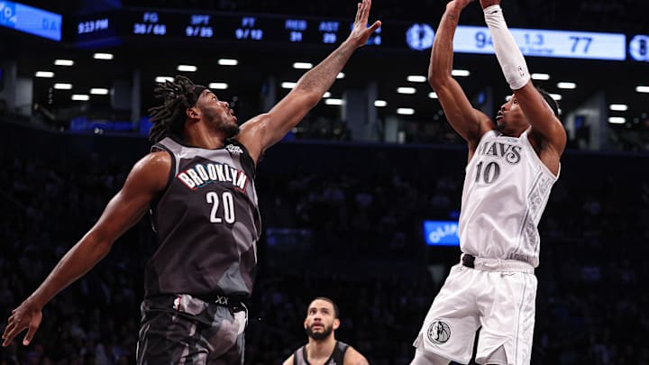 Mar 24, 2025; Brooklyn, New York, USA; Dallas Mavericks guard Brandon Williams (10) shoots the ball against Brooklyn Nets center Day'Ron Sharpe (20) during the second half at Barclays Center. Mandatory Credit: Vincent Carchietta-Imagn Images Mar 24, 2025; Brooklyn, New York, USA; Dallas Mavericks guard Brandon Williams (10) shoots the ball against Brooklyn Nets center Day'Ron Sharpe (20) during the second half at Barclays Center. Mandatory Credit: Vincent Carchietta-Imagn Images