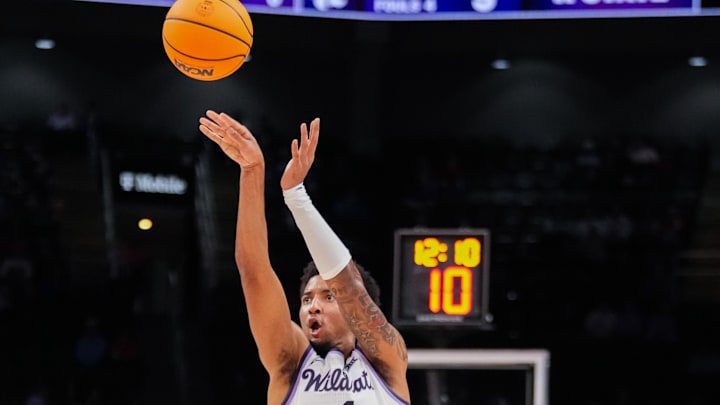 Nov 20, 2025; Kansas City, Missouri, USA; Kansas State Wildcats guard PJ Haggerty (4) shoots against the Mississippi State Bulldogs during the first half of the game at T-Mobile Center. Mandatory Credit: Denny Medley-Imagn Images