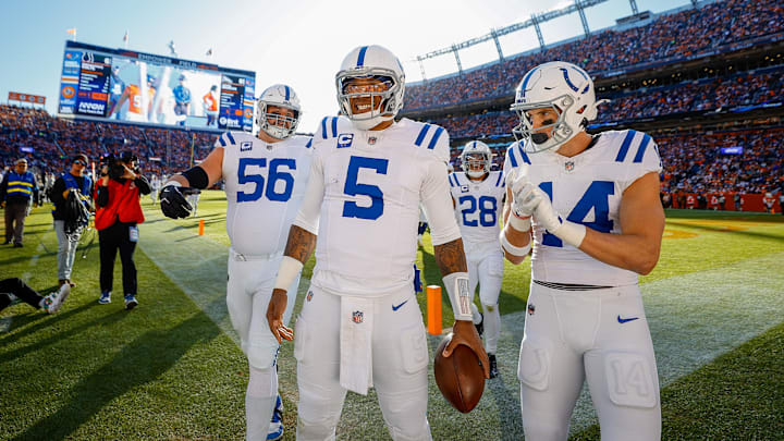 Dec 15, 2024; Denver, Colorado, USA; Indianapolis Colts quarterback Anthony Richardson (5) celebrates with guard Quenton Nelson (56) and wide receiver Alec Pierce (14) after a touchdown in the first quarter against the Denver Broncos at Empower Field at Mile High. Mandatory Credit: Isaiah J. Downing-Imagn Images