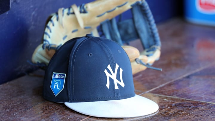 Mar 24, 2018; Tampa, FL, USA;New York Yankees hat and glove lay in the dugout  at George M. Steinbrenner Field. Mandatory Credit: Kim Klement-Imagn Images