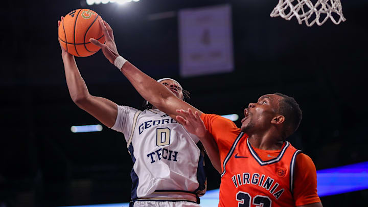Virginia Cavaliers center Ugonna Onyenso and Georgia Tech Yellow Jackets guard Akai Fleming