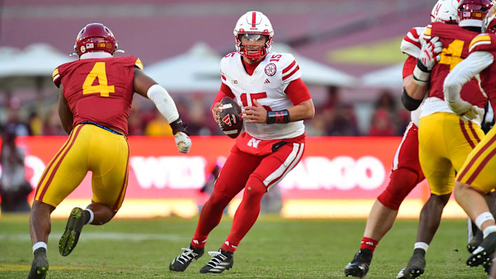 Nov 16, 2024; Los Angeles, California, USA; Nebraska Cornhuskers quarterback Dylan Raiola drops back to pass as Southern California Trojans linebacker Easton Mascarenas-Arnold moves in during the second half at the Los Angeles Memorial Coliseum. 