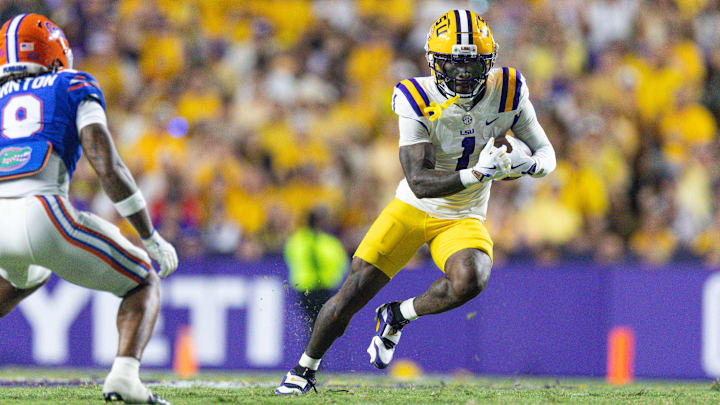 Sep 13, 2025; Baton Rouge, Louisiana, USA;  LSU Tigers wide receiver Aaron Anderson (1) runs against the Florida Gators during the first half at Tiger Stadium. Mandatory Credit: Stephen Lew-Imagn Images