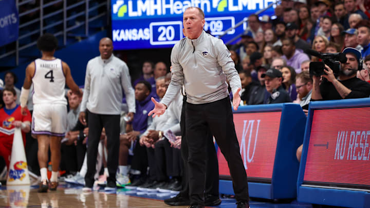 Mar 7, 2026; Lawrence, Kansas, USA; Kansas State Wildcats interim head coach Matthew Driscoll questions a call by the officials during the second half against the Kansas Jayhawks at Allen Fieldhouse. 