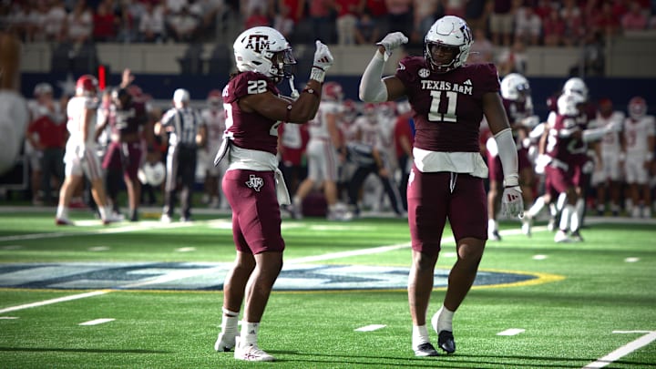 Sep 28, 2024; Arlington, Texas, USA; Texas A&M Aggies defensive lineman Nic Scourton (11) and linebacker Solomon DeShields (22) celebrate after forcing a fumble against the Arkansas Razorbacks at AT&T Stadium. Sep 28, 2024; Arlington, Texas, USA; Texas A&M Aggies defensive lineman Nic Scourton (11) and linebacker Solomon DeShields (22) celebrate after forcing a fumble against the Arkansas Razorbacks at AT&T Stadium.