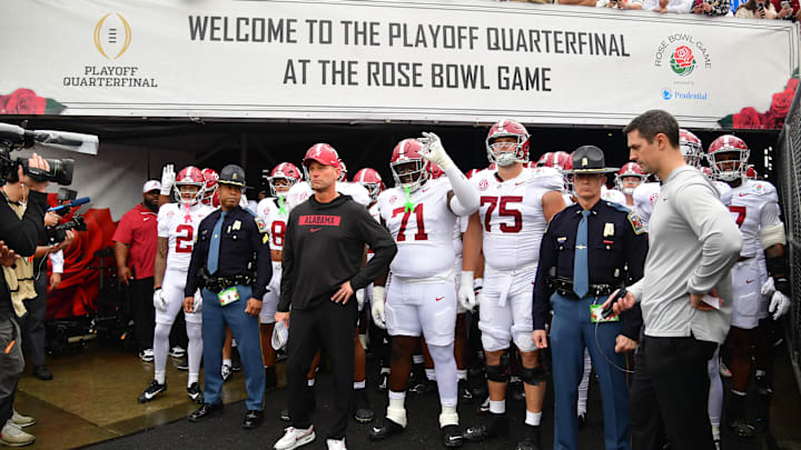 Jan 1, 2026; Pasadena, CA, USA; Alabama Crimson Tide players and head coach Kalen Deboer walk on field before the 2026 Rose Bowl and quarterfinal game of the College Football Playoff against the Indiana Hoosiers at Rose Bowl Stadium. Mandatory Credit: Gary A. Vasquez-Imagn Images