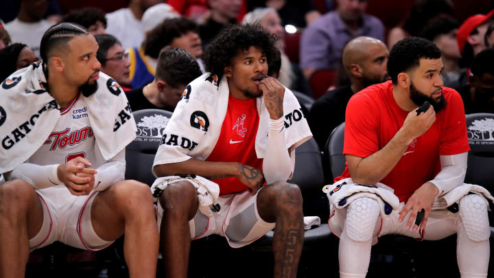 Mar 23, 2024; Houston, Texas, USA; (from L-to-R) Houston Rockets forward Dillon Brooks (9), Houston Rockets guard Jalen Green (4) and Houston Rockets guard Fred VanVleet (5) sit on the bench against the Utah Jazz during the second quarter at Toyota Center. Mandatory Credit: Erik Williams-USA TODAY Sports