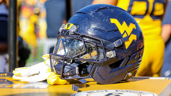 Aug 30, 2025; Morgantown, West Virginia, USA; A West Virginia Mountaineers football helmet is seen along the sidelines during the fourth quarter against the Robert Morris Colonials at Milan Puskar Stadium. Mandatory Credit: Ben Queen-Imagn Images