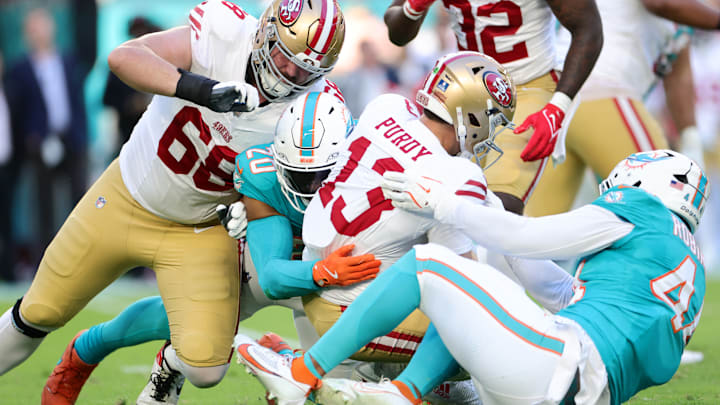 San Francisco 49ers quarterback Brock Purdy is taken down by Miami Dolphins linebacker Jordyn Brooks