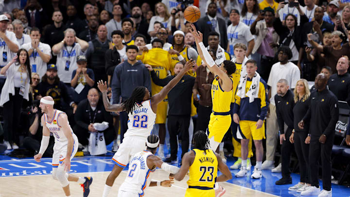 Jun 5, 2025; Oklahoma City, Oklahoma, USA; Indiana Pacers guard Tyrese Haliburton (0) makes the game winning shot over Oklahoma City Thunder guard Cason Wallace (22) during the fourth quarter during game one of the 2025 NBA Finals at Paycom Center. Mandatory Credit: Alonzo Adams-Imagn Images