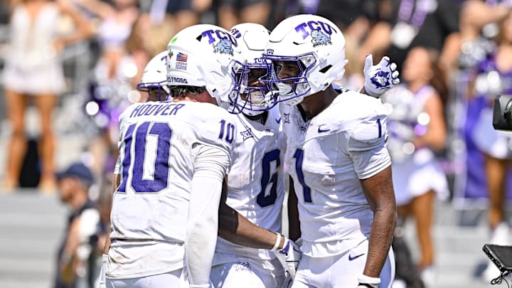 Sep 20, 2025; Fort Worth, Texas, USA; TCU Horned Frogs wide receiver Eric McAlister (1) celebrates with quarterback Josh Hoover (10) and running back Trent Battle (6) after McAlister scores a touchdown against the SMU Mustangs during the second half at Amon G. Carter Stadium. Mandatory Credit: Jerome Miron-Imagn Images
