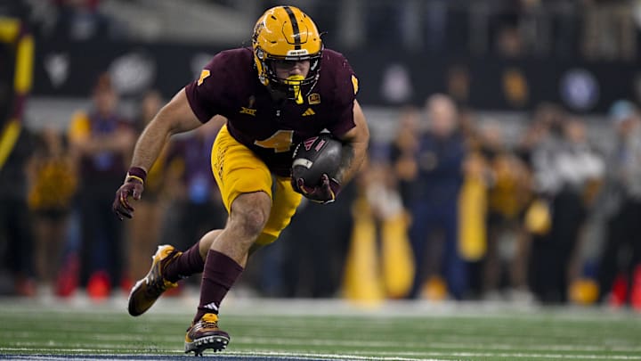 Dec 7, 2024; Arlington, TX, USA; Arizona State Sun Devils running back Cam Skattebo (4) in action during the game between the Iowa State Cyclones and the Arizona State Sun Devils at AT&T Stadium. Mandatory Credit: Jerome Miron-Imagn Images