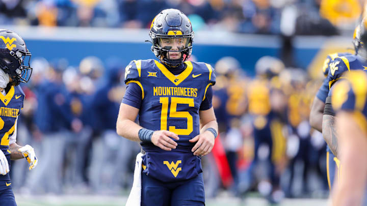 Nov 29, 2025; Morgantown, West Virginia, USA; West Virginia Mountaineers quarterback Scotty Fox Jr. (15) on the field during the second quarter against the Texas Tech Red Raiders at Milan Puskar Stadium. Mandatory Credit: Ben Queen-Imagn Images Nov 29, 2025; Morgantown, West Virginia, USA; West Virginia Mountaineers quarterback Scotty Fox Jr. (15) on the field during the second quarter against the Texas Tech Red Raiders at Milan Puskar Stadium. Mandatory Credit: Ben Queen-Imagn Images