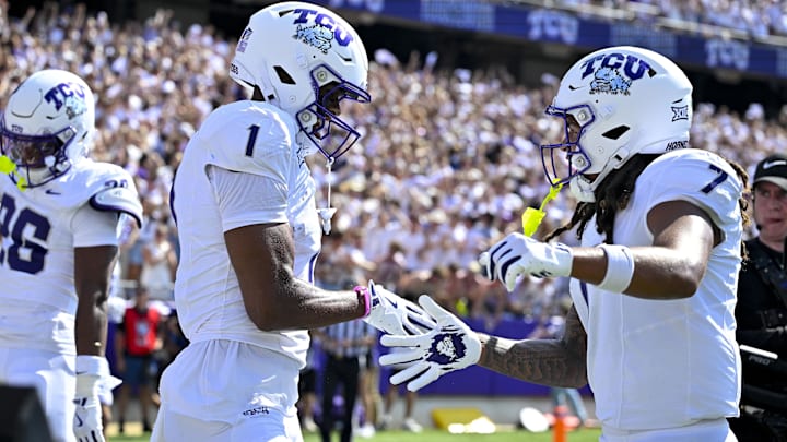 Sep 20, 2025; Fort Worth, Texas, USA; TCU Horned Frogs wide receiver Eric McAlister (1) and wide receiver Jordan Dwyer (7) celebrate after McAlister scores a touchdown against the SMU Mustangs during the first half at Amon G. Carter Stadium. Mandatory Credit: Jerome Miron-Imagn Images