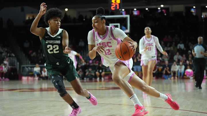 Southern California Trojans guard JuJu Watkins (12) dribbles the ball against Michigan State Spartans guard Nyla Hampton (22) in the first half at Galen Center.