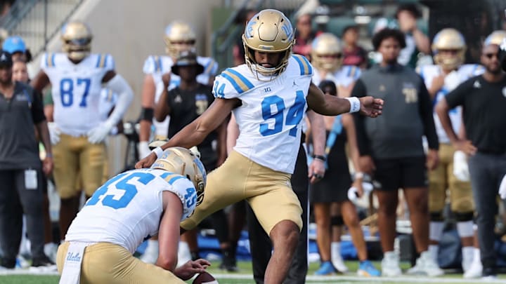 Aug 31, 2024; Honolulu, Hawaii, USA; UCLA Bruins place kicker Mateen Bhaghani (94) makes a field goal against the Hawaii Rainbow Warriors during the third quarter of an NCAA college football game against the UCLA Bruins at the Clarence T.C. Ching Athletics Complex. Mandatory Credit: Marco Garcia-Imagn Images Aug 31, 2024; Honolulu, Hawaii, USA; UCLA Bruins place kicker Mateen Bhaghani (94) makes a field goal against the Hawaii Rainbow Warriors during the third quarter of an NCAA college football game against the UCLA Bruins at the Clarence T.C. Ching Athletics Complex. Mandatory Credit: Marco Garcia-Imagn Images