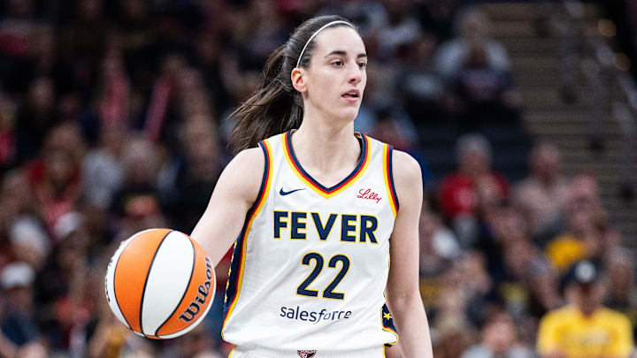 Jul 9, 2025; Indianapolis, Indiana, USA; Indiana Fever guard Caitlin Clark (22) dibbles in the first half against Golden State Valkyries at Gainbridge Fieldhouse. Mandatory Credit: Trevor Ruszkowski-Imagn Images
