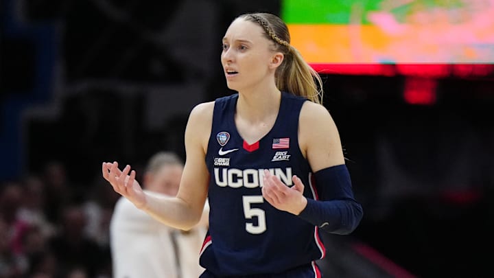 Apr 5, 2024; Cleveland, OH, USA; Connecticut Huskies guard Paige Bueckers (5) reacts in the second quarter against the Iowa Hawkeyes in the semifinals of the Final Four of the womens 2024 NCAA Tournament at Rocket Mortgage FieldHouse. Mandatory Credit: Kirby Lee-Imagn Images