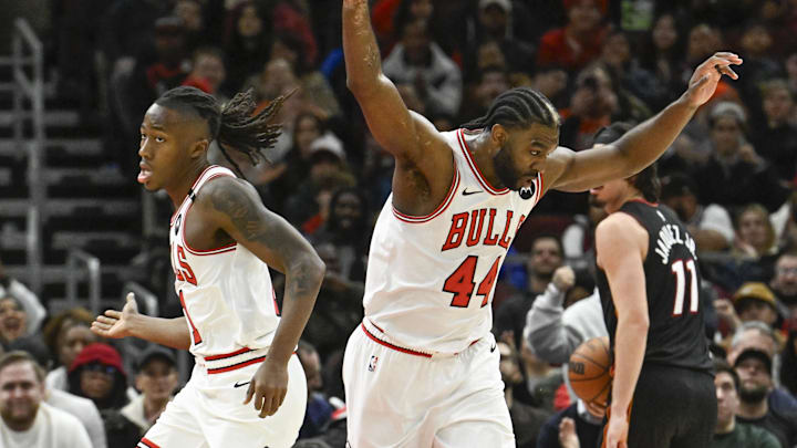 Feb 4, 2025; Chicago, Illinois, USA;  Chicago Bulls forward Patrick Williams (44) reacts with guard Ayo Dosunmu (11) after he dunked the ball against the Miami Heat during the second half at United Center. Mandatory Credit: Matt Marton-Imagn Images