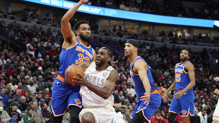 Jan 4, 2025; Chicago, Illinois, USA; Chicago Bulls forward Patrick Williams (44) drives to the basket against New York Knicks center Karl-Anthony Towns (32) during the first quarter at United Center. Mandatory Credit: David Banks-Imagn Images