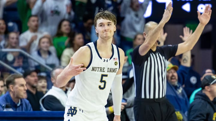 Feb 28, 2026; South Bend, Indiana, USA; Notre Dame Fighting Irish guard Cole Certa (5) celebrates making a 3-point shot during overtime at Purcell Pavilion at the Joyce Center. Mandatory Credit: Michael Caterina-Imagn Images