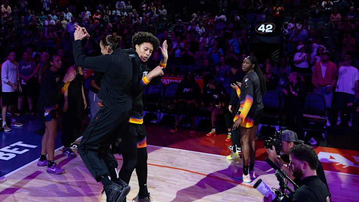 Phoenix Mercury guard Diana Taurasi (3) and Phoenix Mercury center Brittney Griner (42) jump for a side bump before playing the Connecticut Sun on July 1, 2024 at Footprint Center in Phoenix.
