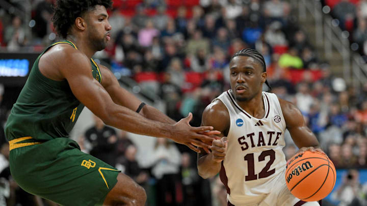 Mar 21, 2025; Raleigh, NC, USA; Baylor Bears forward Norchad Omier (15) defends against Mississippi State Bulldogs guard Josh Hubbard (12) during the first half in the first round of the NCAA Tournament at Lenovo Center. Mandatory Credit: Zachary Taft-Imagn Images