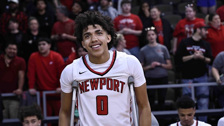 Newport's Taylen Kinney reacts after Newport's Ninth Region championship win over Cooper Tuesday, March 12, 2024. Kinney was injured in the first half.