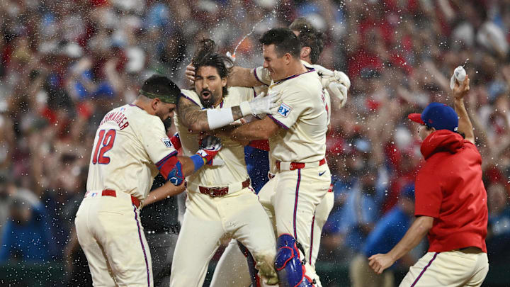 Oct 6, 2024; Philadelphia, Pennsylvania, USA; Philadelphia Phillies outfielder Nick Castellanos (8) celebrates with teammates after defeating the New York Mets during game two of the NLDS for the 2024 MLB Playoffs at Citizens Bank Park.