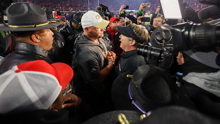 Nov 29, 2024; Athens, Georgia, USA; Georgia Tech Yellow Jackets head coach Brent Key talks to Georgia Bulldogs head coach Kirby Smart after an eight overtime game at Sanford Stadium. Mandatory Credit: Brett Davis-Imagn Images Nov 29, 2024; Athens, Georgia, USA; Georgia Tech Yellow Jackets head coach Brent Key talks to Georgia Bulldogs head coach Kirby Smart after an eight overtime game at Sanford Stadium. Mandatory Credit: Brett Davis-Imagn Images