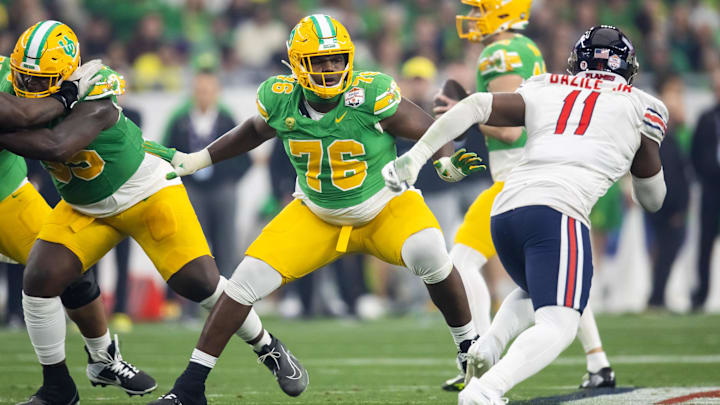 Jan 1, 2024; Glendale, AZ, USA; Oregon Ducks offensive lineman Josh Conerly Jr. (76) against the Liberty Flames during the 2024 Fiesta Bowl at State Farm Stadium. Mandatory Credit: Mark J. Rebilas-Imagn Images