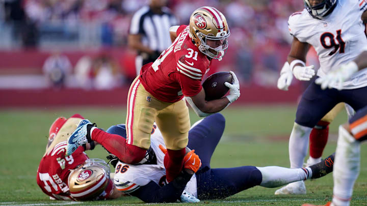 Dec 8, 2024; Santa Clara, California, USA; San Francisco 49ers running back Isaac Guerendo (31) runs the ball against the Chicago Bears in the third quarter at Levi's Stadium. Mandatory Credit: Cary Edmondson-Imagn Images