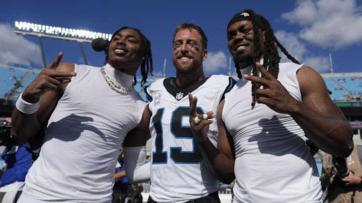 Oct 1, 2023; Charlotte, North Carolina, USA; Minnesota Vikings wide receiver Justin Jefferson (18) (left) and Carolina Panthers wide receiver Adam Thielen (19) and Minnesota Vikings wide receiver K.J. Osborn (17) (right) after the game at Bank of America Stadium. Oct 1, 2023; Charlotte, North Carolina, USA; Minnesota Vikings wide receiver Justin Jefferson (18) (left) and Carolina Panthers wide receiver Adam Thielen (19) and Minnesota Vikings wide receiver K.J. Osborn (17) (right) after the game at Bank of America Stadium.