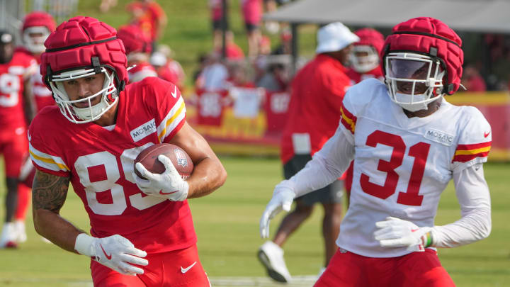 Jul 26, 2024; Kansas City, MO, USA; Kansas City Chiefs wide receiver Jaaron Hayek (89) catches a pass as cornerback Nic Jones (31) defends during training camp at Missouri Western State University. Mandatory Credit: Denny Medley-USA TODAY Sports