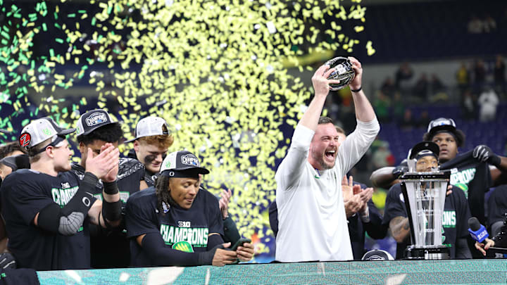Dec 7, 2024; Indianapolis, IN, USA; Oregon Ducks head coach Dan Lanning and the Oregon Ducks celebrate defeating the Penn State Nittany Lions to win the Big Ten Championship in the 2024 Big Ten Championship game at Lucas Oil Stadium. Mandatory Credit: Jordan Prather-Imagn Images