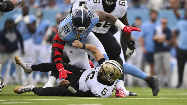 Dec 28, 2025; Nashville, Tennessee, USA;  Tennessee Titans defensive tackle Jeffery Simmons (98) sacks New Orleans Saints quarterback Tyler Shough (6) forcing a fumble during the first quarter of the game at Nissan Stadium. Mandatory Credit: Steve Roberts-Imagn Images