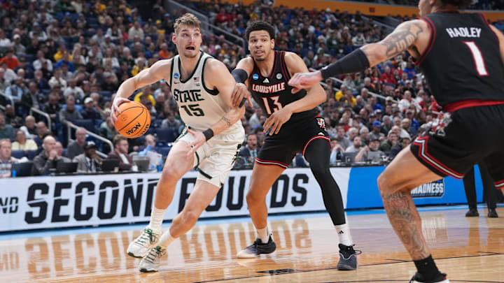 Mar 21, 2026; Buffalo, NY, USA; Michigan State Spartans center Carson Cooper (15) drives to the basket in the second half against the Louisville Cardinals during a second round game of the men's 2026 NCAA Tournament at Keybank Center. Mandatory Credit: Gregory Fisher-Imagn Images