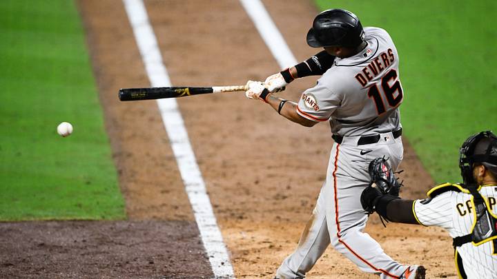 Jul 30, 2026; San Diego, California, USA; San Francisco Giants first baseman Rafael Devers (16) hits single during the seventh inning against the San Diego Padres at Petco Park. Mandatory Credit: Denis Poroy-Imagn Images