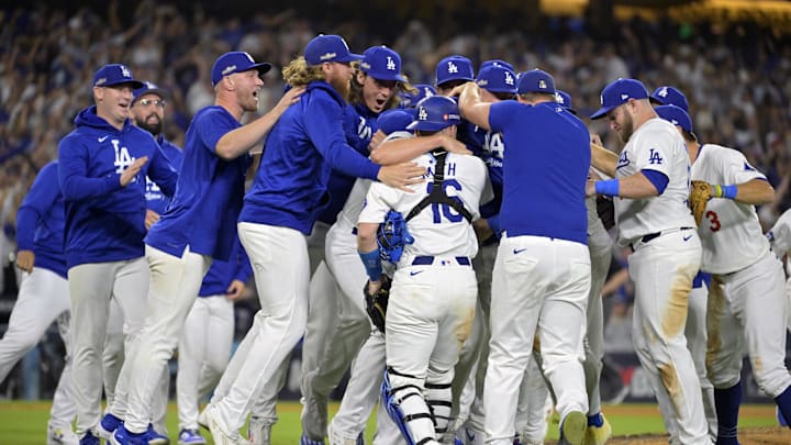 Oct 20, 2024; Los Angeles, California, USA; Los Angeles Dodgers players celebrate after defeating the New York Mets in game six of the NLCS for the 2024 MLB playoffs at Dodger Stadium.