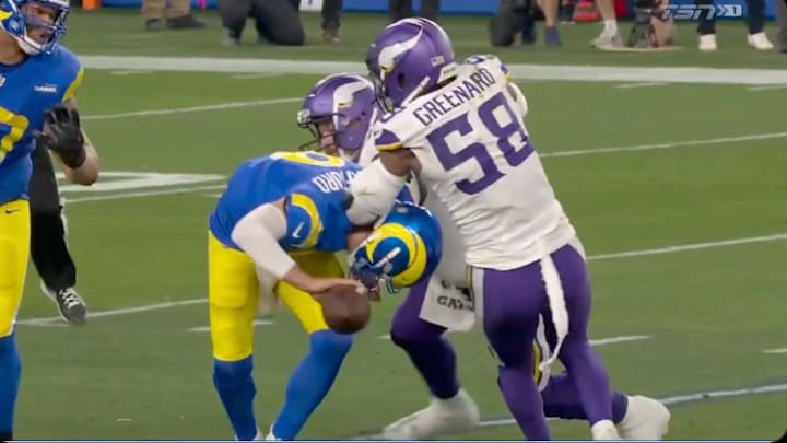 Matthew Stafford avoids a fumble by tossing an incomplete pass against the Minnesota Vikings.
