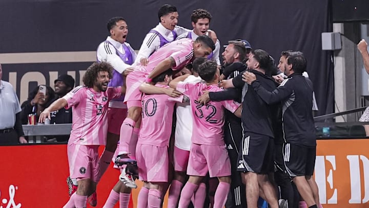 Inter Miami players celebrate after scoring a goal against Atlanta United during the second half at Mercedes-Benz Stadium.