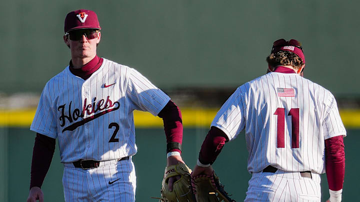 Pete Daniel (2) and Ethan Ball convene to reset on defense. 