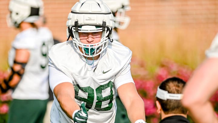 Michigan State's Avery Dunn runs a drill during the opening day of fall camp on Thursday, Aug. 5, 2021, on the MSU campus in East Lansing.

210805 Msu Fball Camp 043a