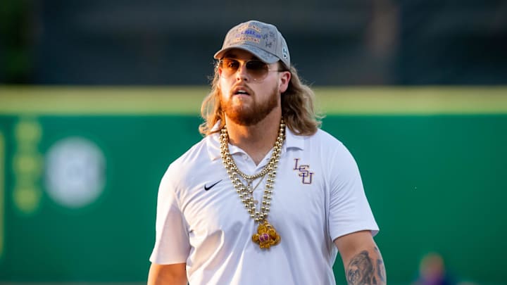 Tommy White walks onto the field as the Tiger fans welcome the LSU Tigers Baseball team home at Alex