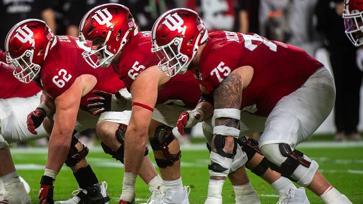 Indiana's Drew Evans (62), Carter Smith (65) and Zen Michalski (75) prepare for a snap during the College Football Playoff National Championship college football game at Hard Rock Stadium in Miami Gardens on Monday, Jan. 19, 2026. Indiana's Drew Evans (62), Carter Smith (65) and Zen Michalski (75) prepare for a snap during the College Football Playoff National Championship college football game at Hard Rock Stadium in Miami Gardens on Monday, Jan. 19, 2026.