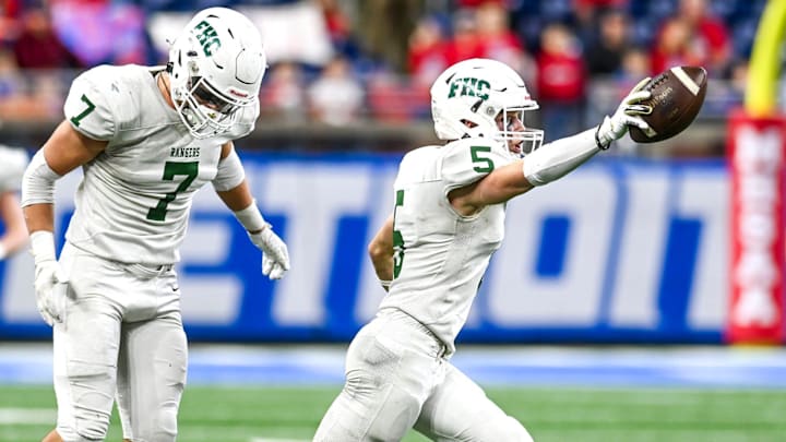 Forest Hills Central's Ty Hudkins celebrates his interception during the second quarter in the game against Mason on Sunday, Nov. 26, 2023, at Ford Field in Detroit. Forest Hills Central's Ty Hudkins celebrates his interception during the second quarter in the game against Mason on Sunday, Nov. 26, 2023, at Ford Field in Detroit.